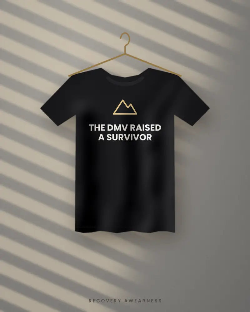 The DMV Raised A Survivor — black tee