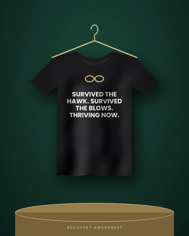 Survived The Hawk. Survived The Blows. Thriving Now. — black tee