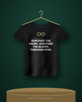 Survived The Hawk. Survived The Blows. Thriving Now. — black tee