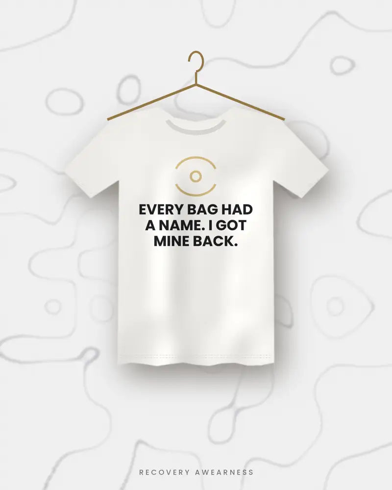 Every Bag Had A Name. I Got Mine Back. — white tee