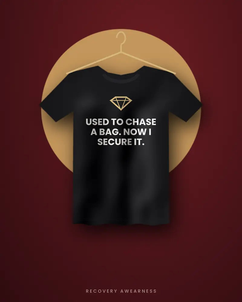 Used To Chase A Bag. Now I Secure It. — black tee